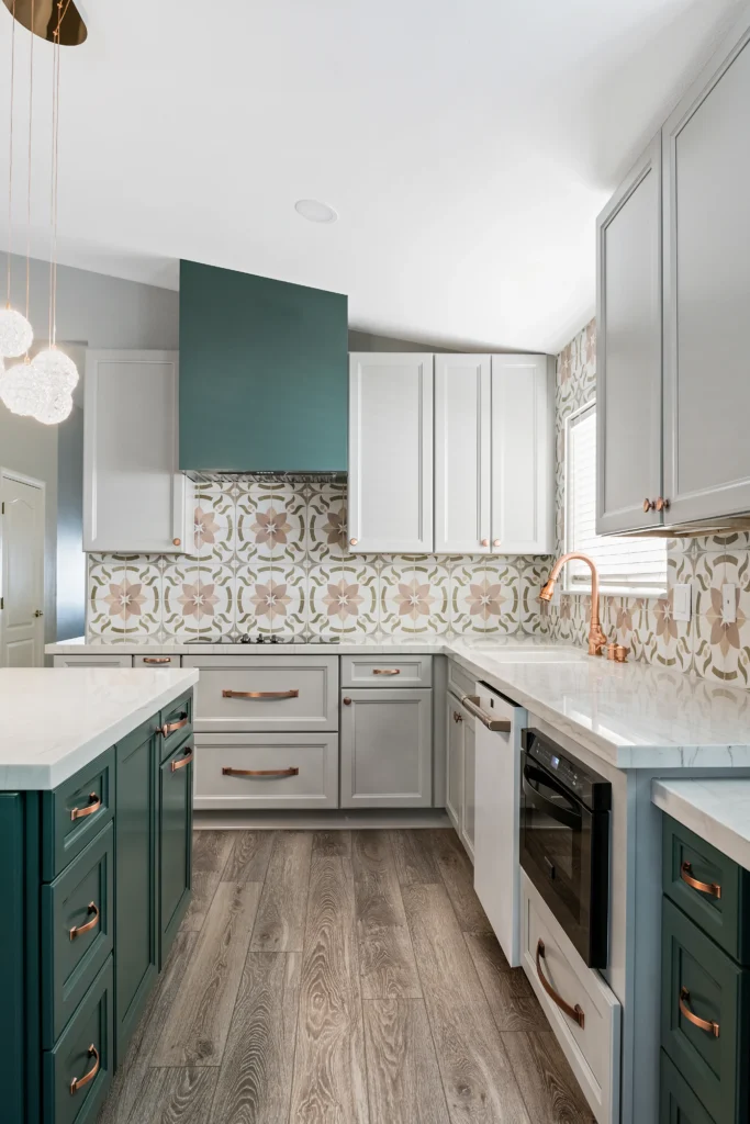 Contemporary teal and gray kitchen with elegant finishes and inviting natural light.