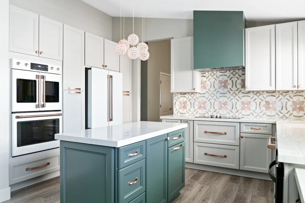 Modern Deliah Kitchen featuring elegant teal cabinetry, white island, and unique geometric tile backsplash.