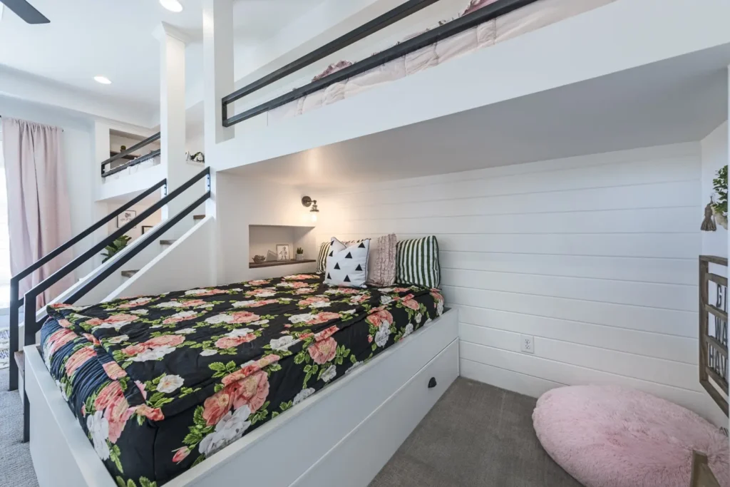 Modern multi-level bedroom design with floral accents, cozy decor, and abundant natural light.