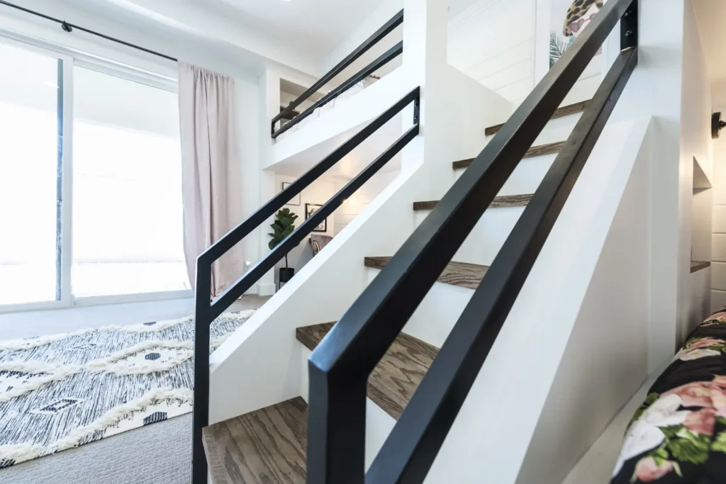 Modern Staircase in The Harvard Project: Chic Interior Design Chic modern interior with a stylish staircase and inviting seating area bathed in natural light.