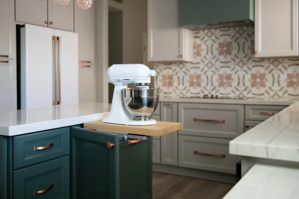 Stylish kitchen featuring a white stand mixer, modern cabinets, and warm wooden accents.