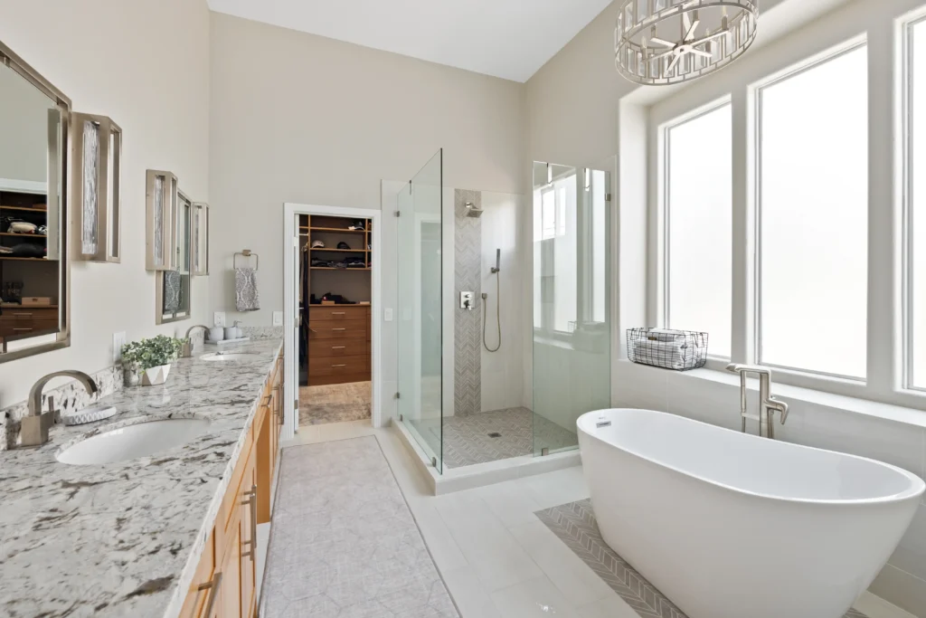 Luxurious Mesa bathroom with marble countertops, freestanding tub, and glass walk-in shower.