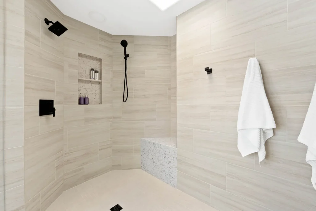 Stylish modern shower with rain showerhead, skylight, and minimalist design for a serene experience.