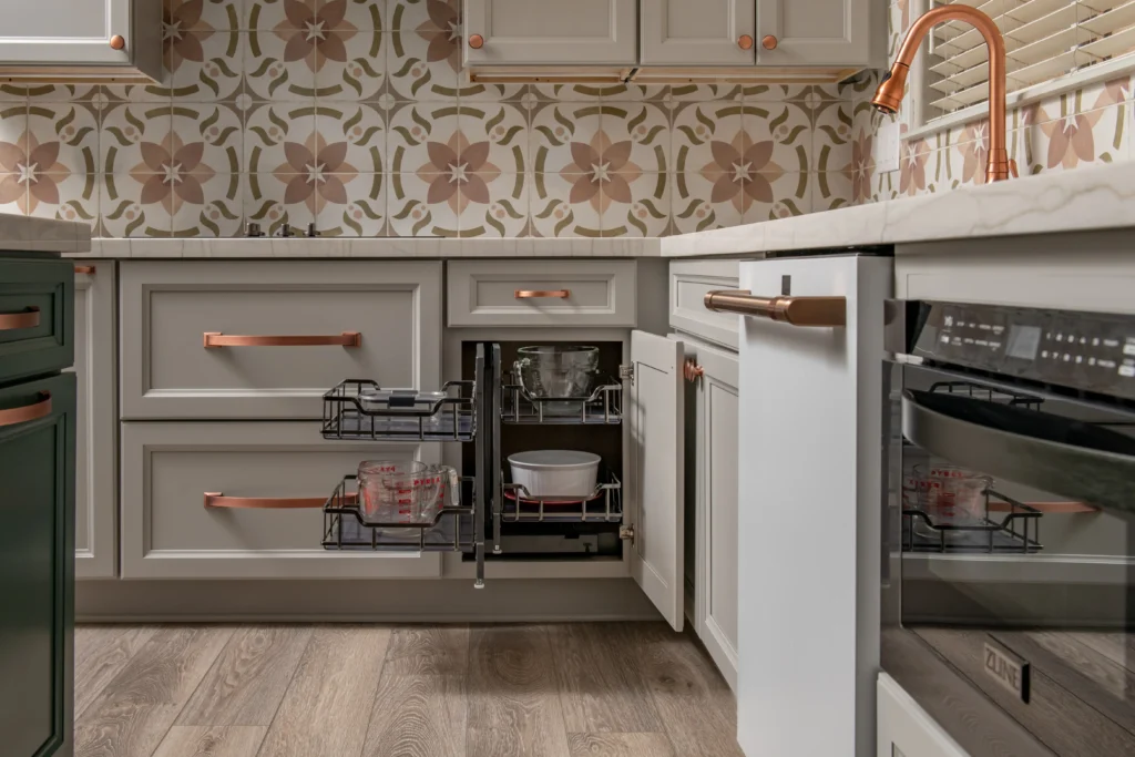 Charming kitchen blend of modern and vintage with floral accents, gray cabinetry, and bright ambiance.