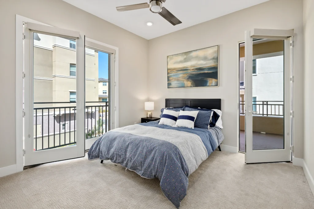 Modern Las Vegas bedroom with cozy decor, natural light, and serene atmosphere.