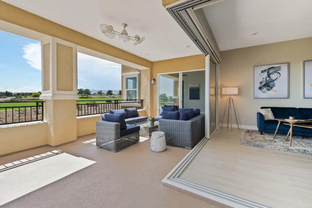 Elegant living area blending indoor comfort with serene outdoor views at The Indy.