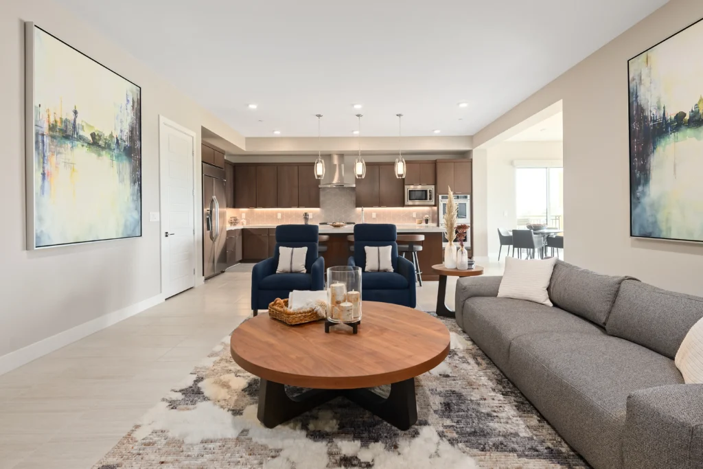 Modern living room with stylish decor, inviting seating, and seamless open kitchen design.