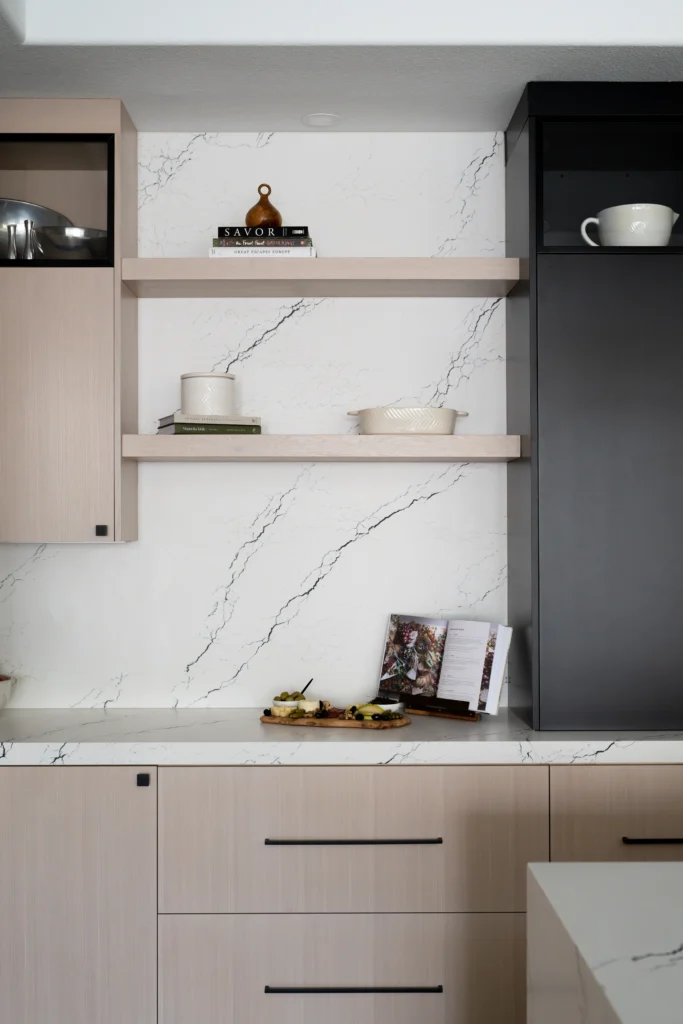 Elegant two-tone kitchen with pink and black cabinets, showcasing modern design and functional beauty.