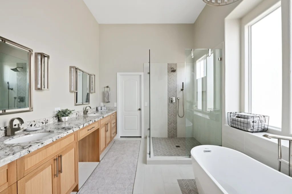 Elegant bathroom design with dual vanities, freestanding tub, and spacious shower enclosure.