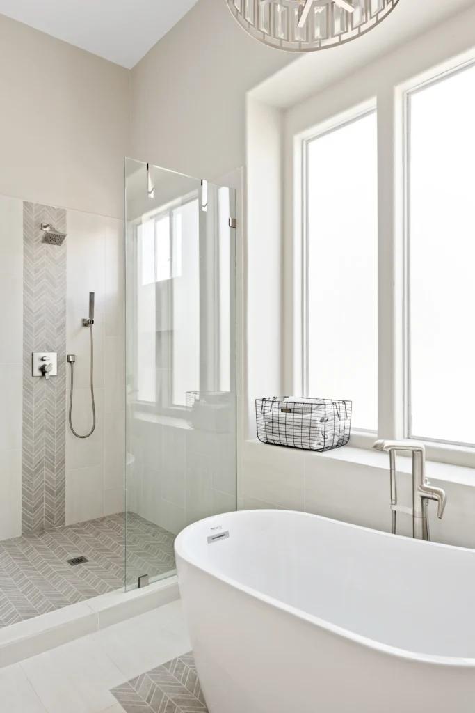 Luxurious Mesa bathroom with freestanding tub, natural light, and elegant minimalist design.