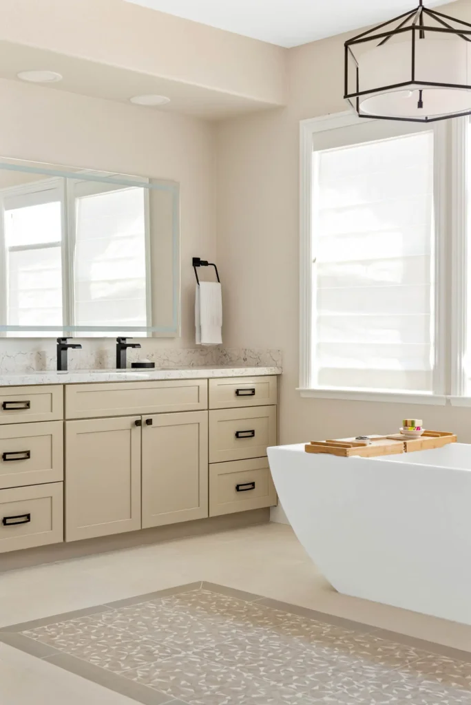 Modern bathroom retreat featuring a freestanding bathtub, spacious vanity, and elegant lighting design.