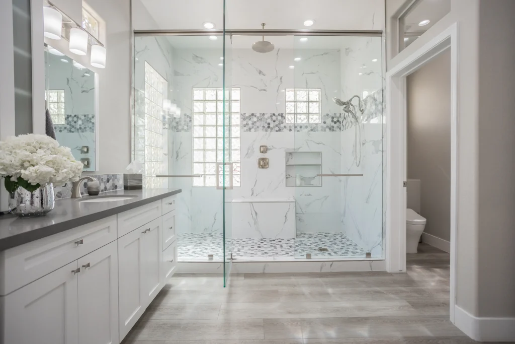 Luxurious modern bathroom with sleek design, elegant shower, and warm wood accents in Las Vegas.