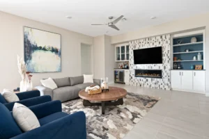 Inviting contemporary living room design with cozy furnishings and a stylish electric fireplace.