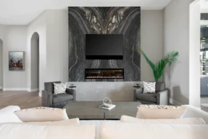 Sophisticated modern living room with a striking stone wall, cozy fireplace, and inviting decor.