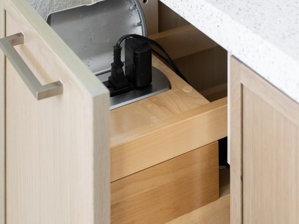 bathroom drawer with built-in power strip and concealed charging station, Reveal Interior Design Las Vegas
