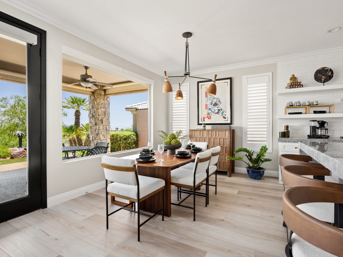 Japandi-inspired dining room with walnut table, cloud-fabric seating, and sculptural wood-and-metal chandelier, Reveal Interior Design Las Vegas