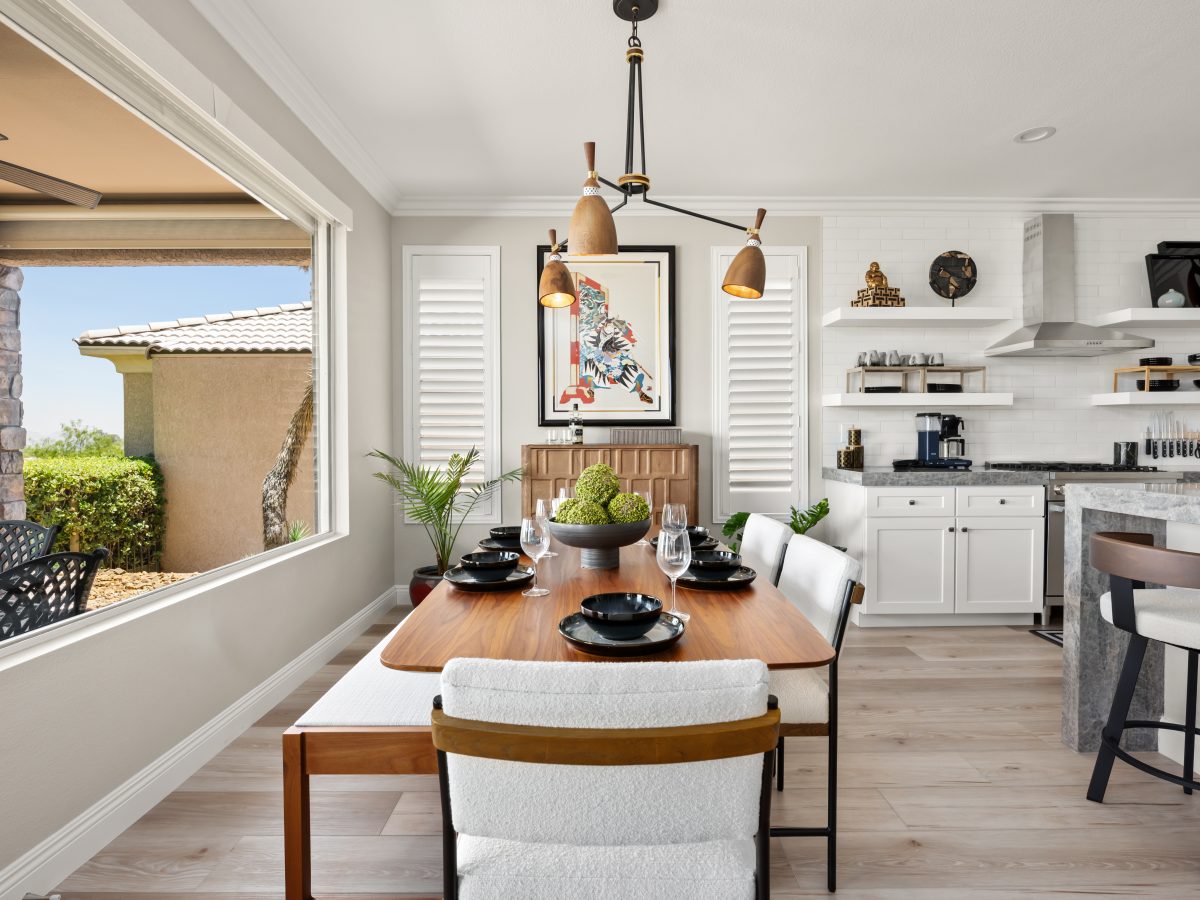 Japandi-inspired dining room with walnut table, cloud-fabric seating, and sculptural wood-and-metal chandelier, Reveal Interior Design Las Vegas