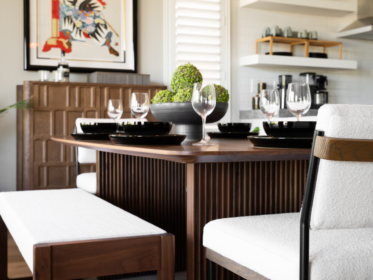Japandi dining room with walnut table, dimensional storage chest, and cloud-fabric seating, Reveal Interior Design Las Vegas
