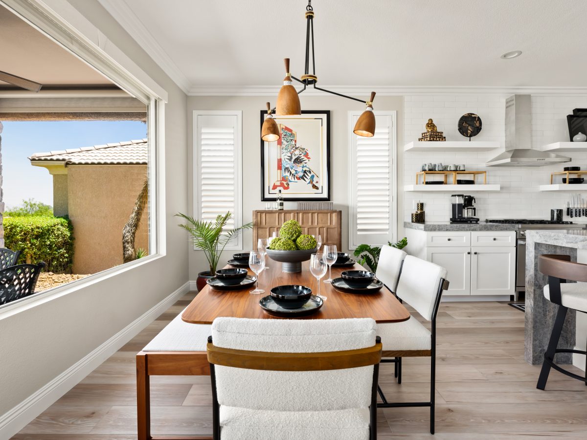 Japandi-inspired dining room with walnut table, cloud fabric seating, and sculptural wood-and-metal chandelier, Reveal Interior Design Las Vegas