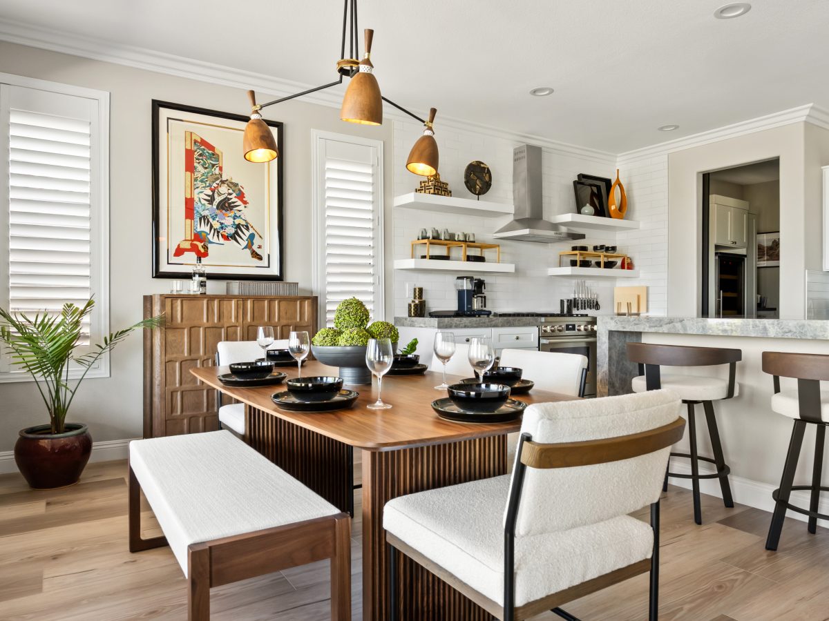 Japandi-inspired dining room with walnut table, dimensional storage chest, and sculptural chandelier, Reveal Interior Design Las Vegas