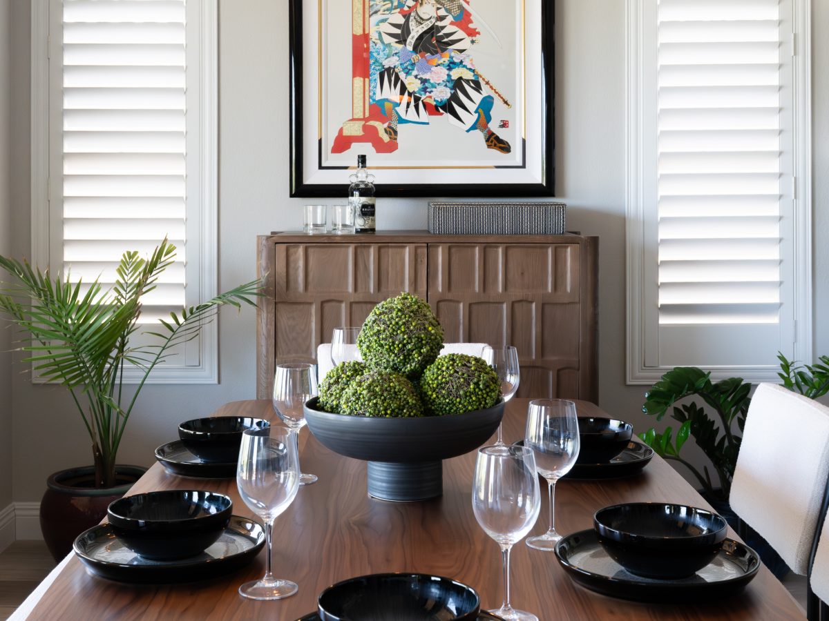 Japandi-inspired dining room with modern walnut table and dimensional walnut bar cabinet, Reveal Interior Design Las Vegas