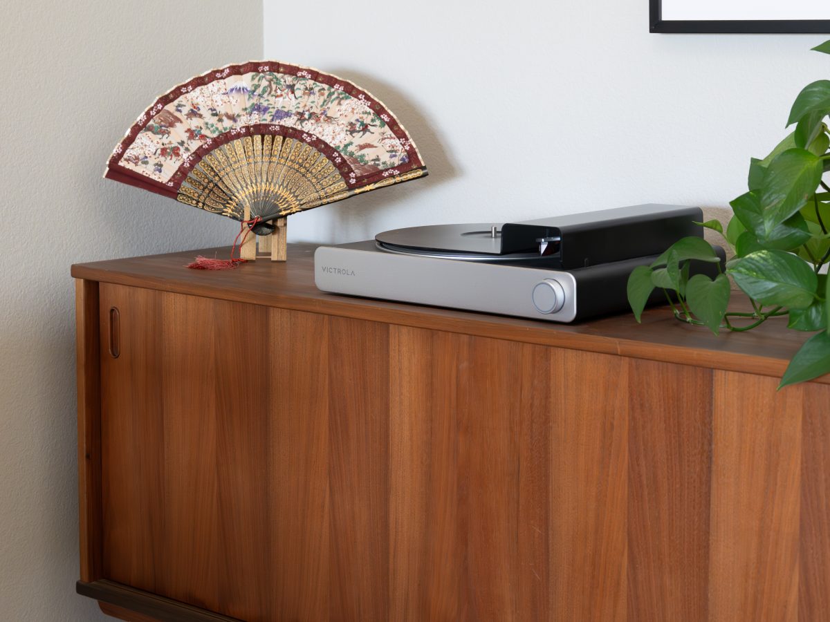 Mid-century sideboard with decorative Japanese fan and Victrola turntable, Reveal Interior Design Las Vegas