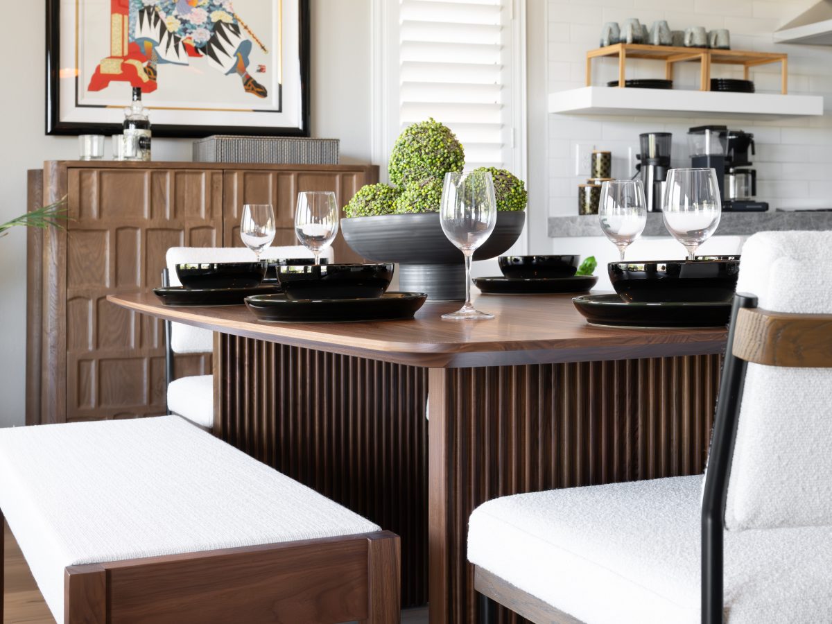 Japandi dining room with walnut table, dimensional storage chest, and cloud-fabric seating, Reveal Interior Design Las Vegas