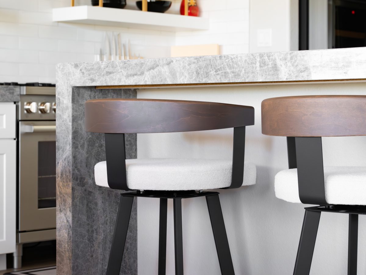 Modern kitchen island with swivel counter stools in off-white fabric and walnut, Reveal Interior Design Las Vegas