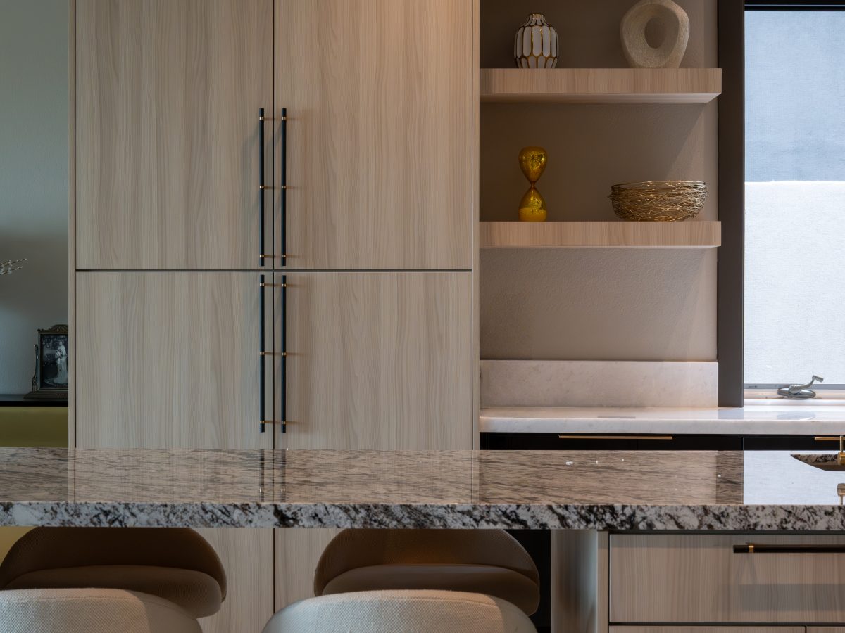 Luxury kitchen with granite island, white oak cabinetry, and gold pendant lighting, Reveal Interior Design Las Vegas