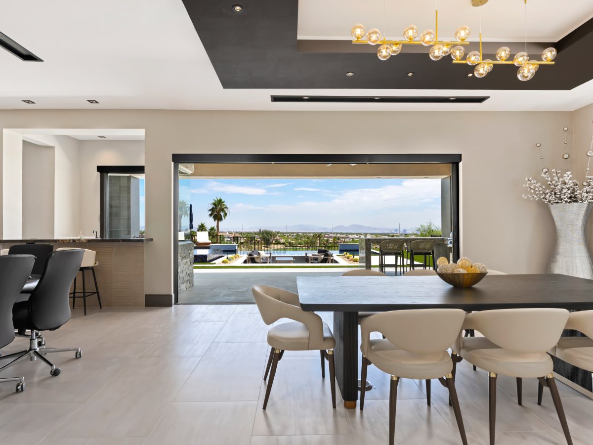 Custom wine niche with modern metal shelving, mirrored panels, and hidden LED lighting, Reveal Interior Design Las Vegas