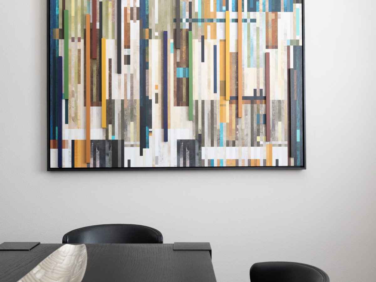Dining room with large-scale dimensional wall art and chunky black dining table, Reveal Interior Design Las Vegas