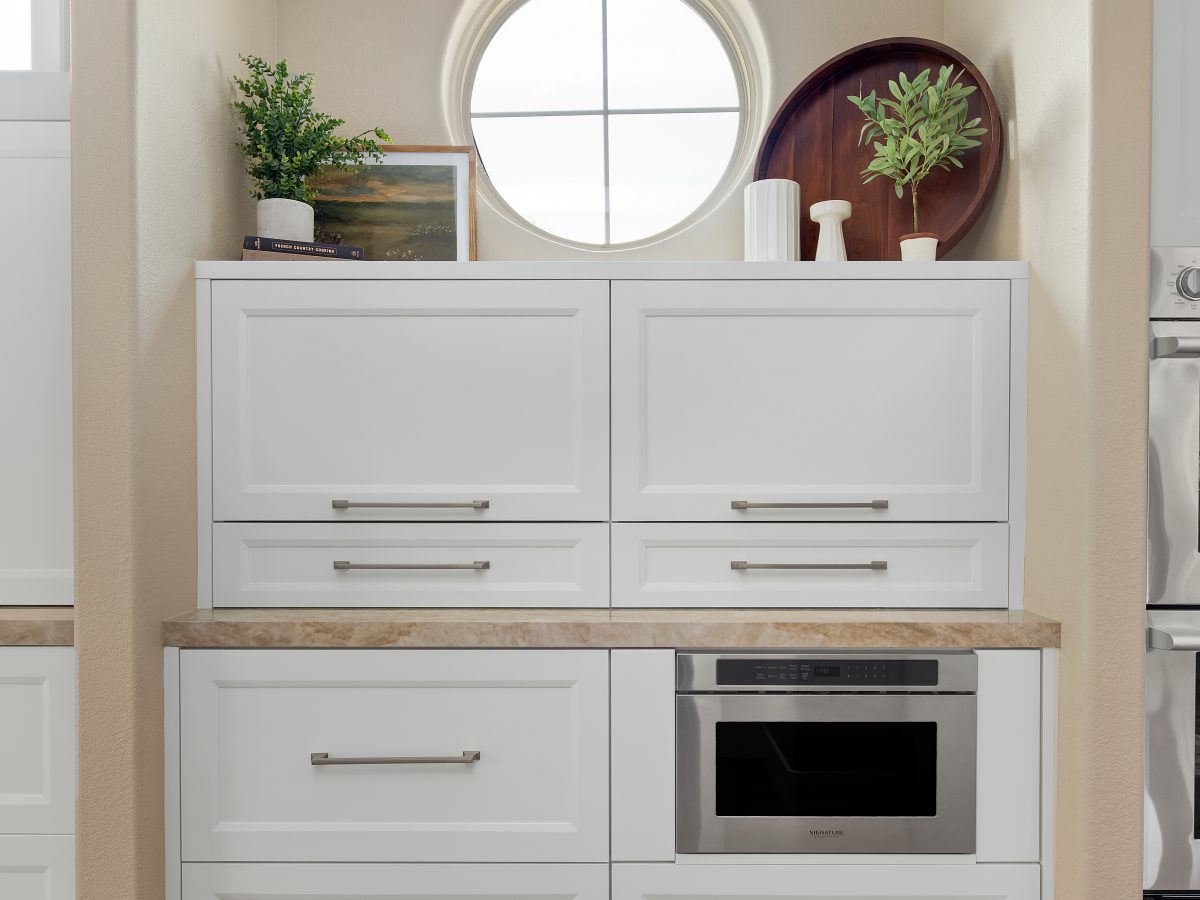 Transitional butler's pantry with white shaker cabinetry, Dekton countertop, and undercounter microwave, Reveal Interior Design Las Vegas