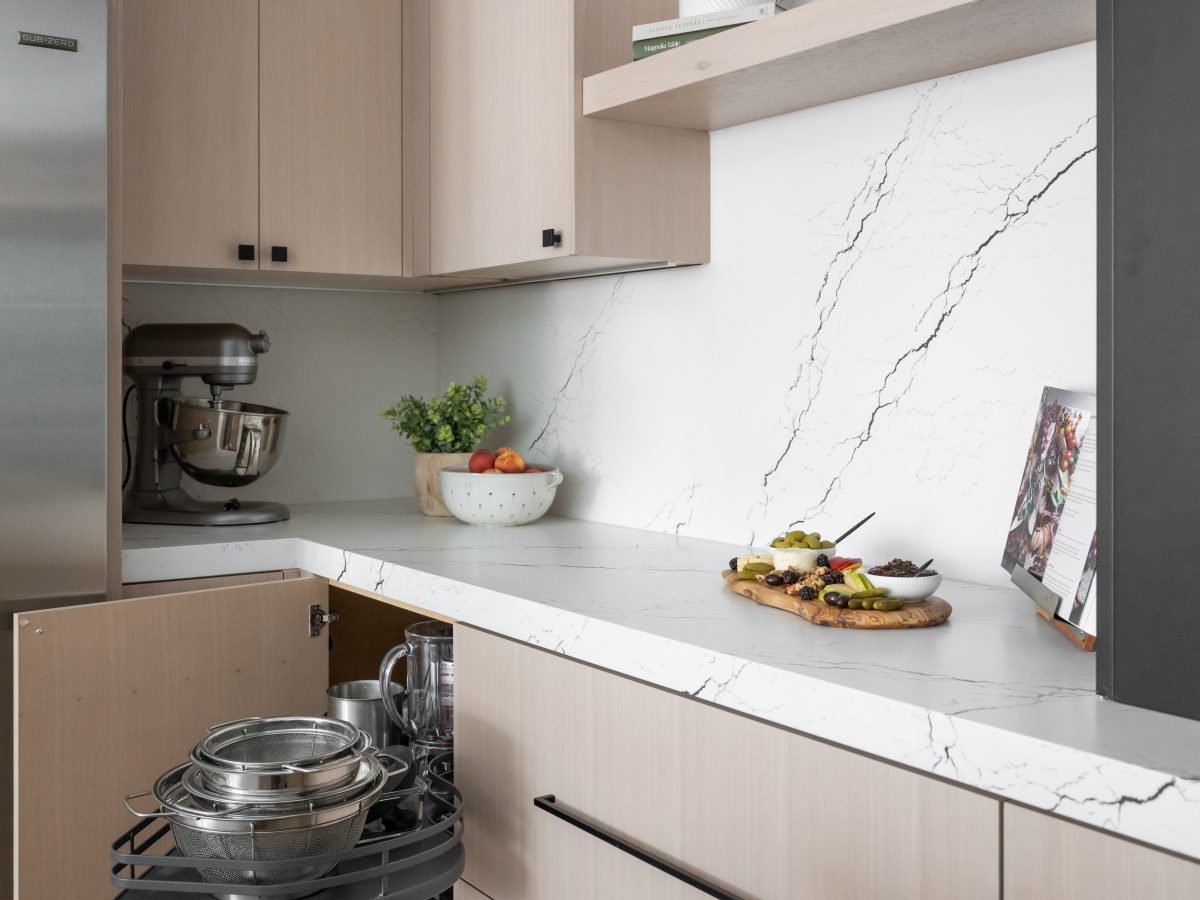 Contemporary kitchen with white-washed oak cabinetry, black-veined white quartz countertops and backsplash, Reveal Interior Design Las Vegas