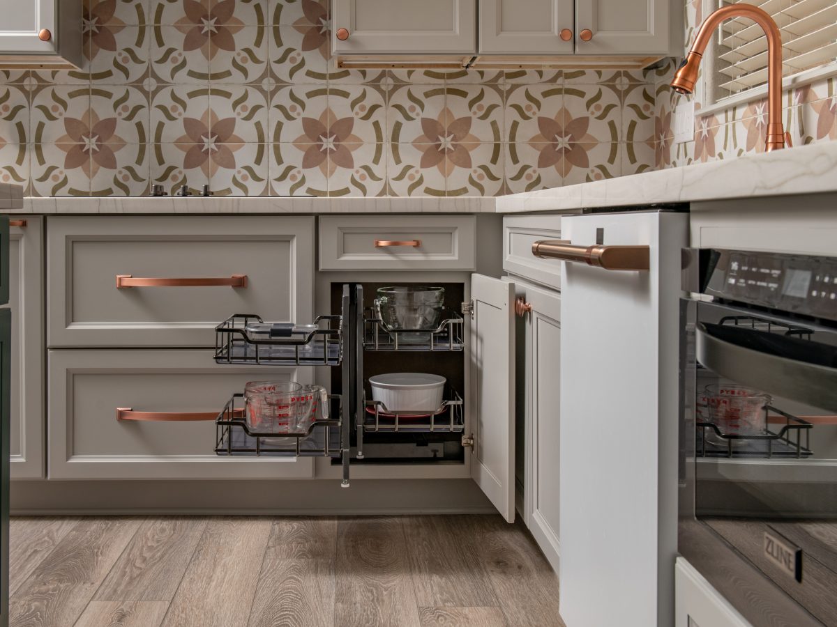 Transitional kitchen with encaustic ceramic tile backsplash, copper hardware, and pull-out cabinet organization, Reveal Interior Design Las Vegas