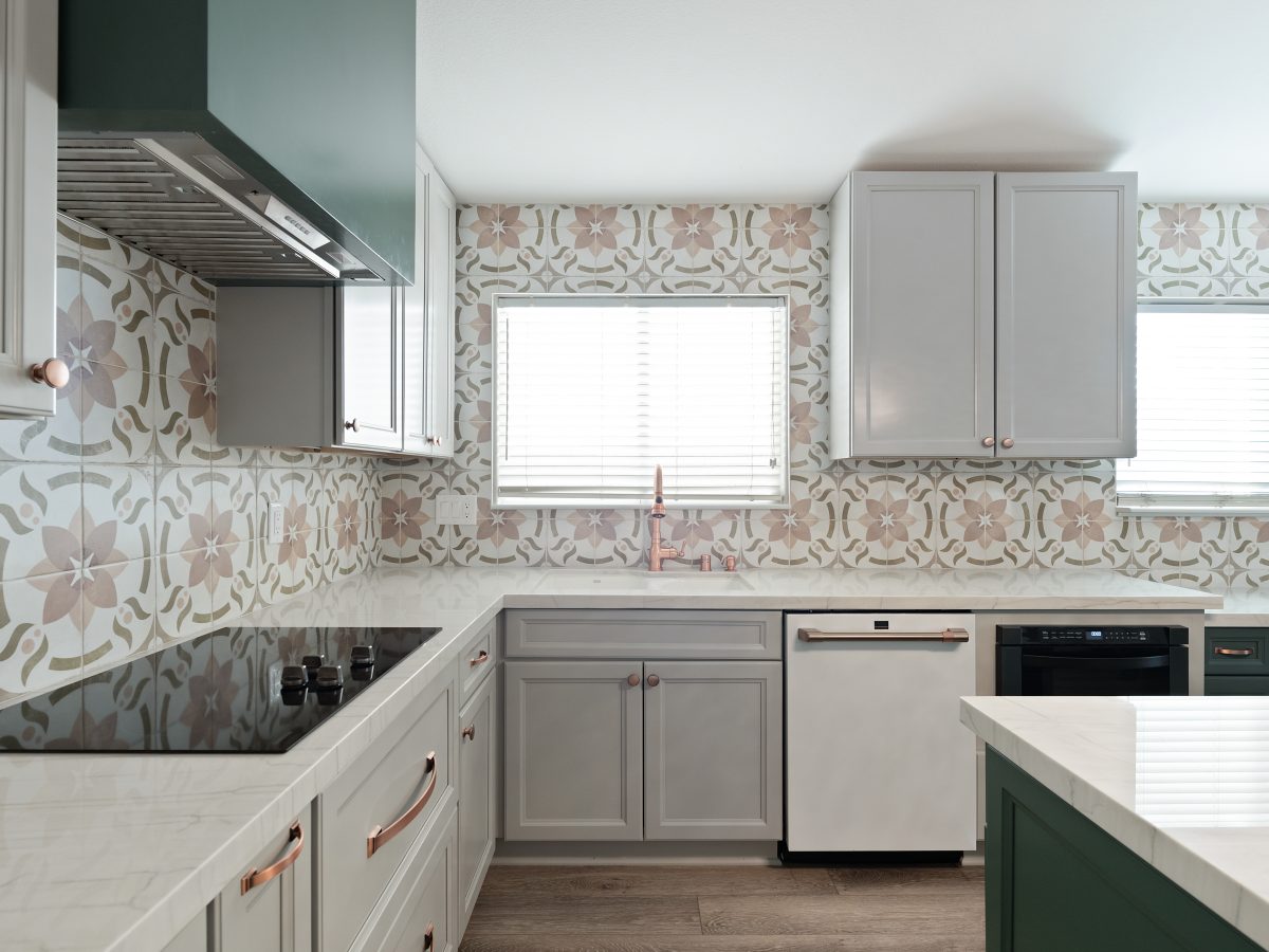 Kitchen with encaustic ceramic tile backsplash, emerald green island, and white quartz countertops, Reveal Interior Design Las Vegas