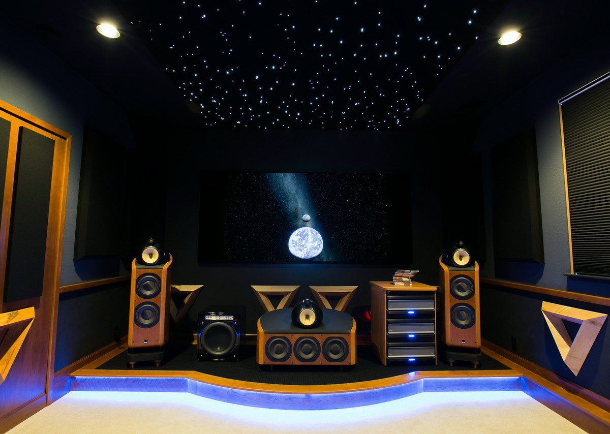 Home theater with fiber optic star ceiling, maple acoustic panels, and raised speaker stage, Reveal Interior Design Las Vegas