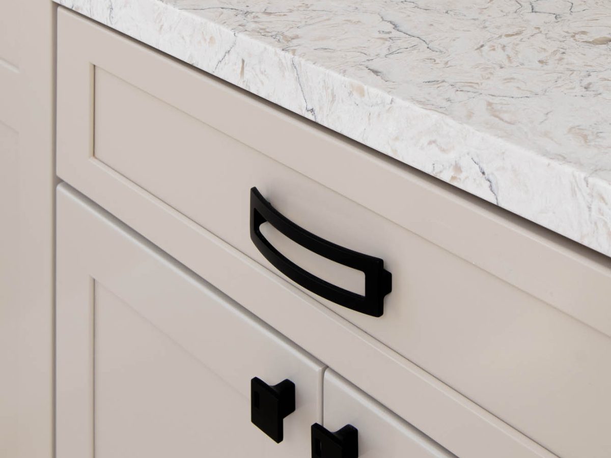 Primary bathroom with warm beige cabinetry and white veined quartz countertops, Reveal Interior Design Las Vegas