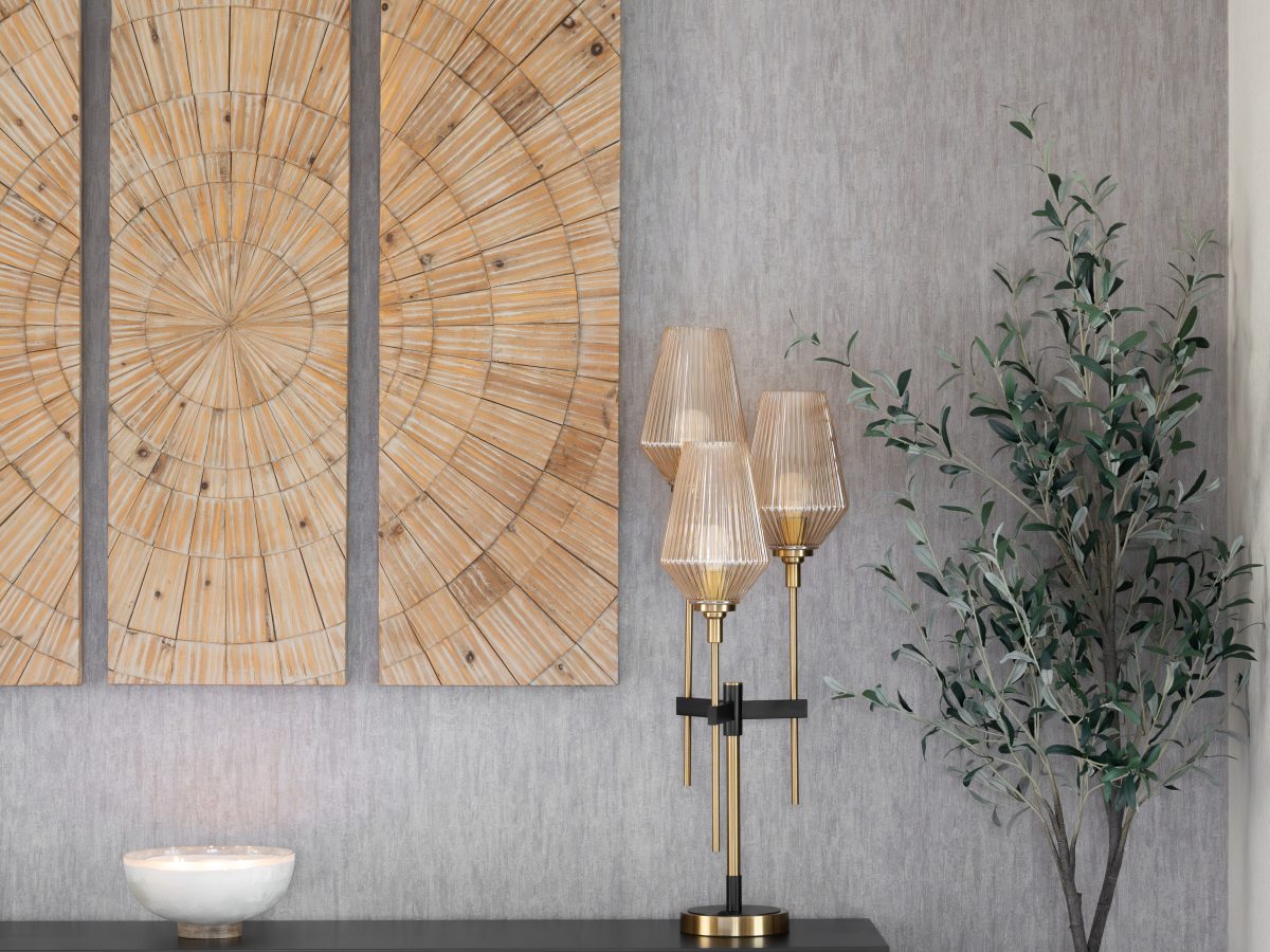 Living room vignette with gray metallic wallpaper, sculptural wood wall art, and black console, Reveal Interior Design Las Vegas