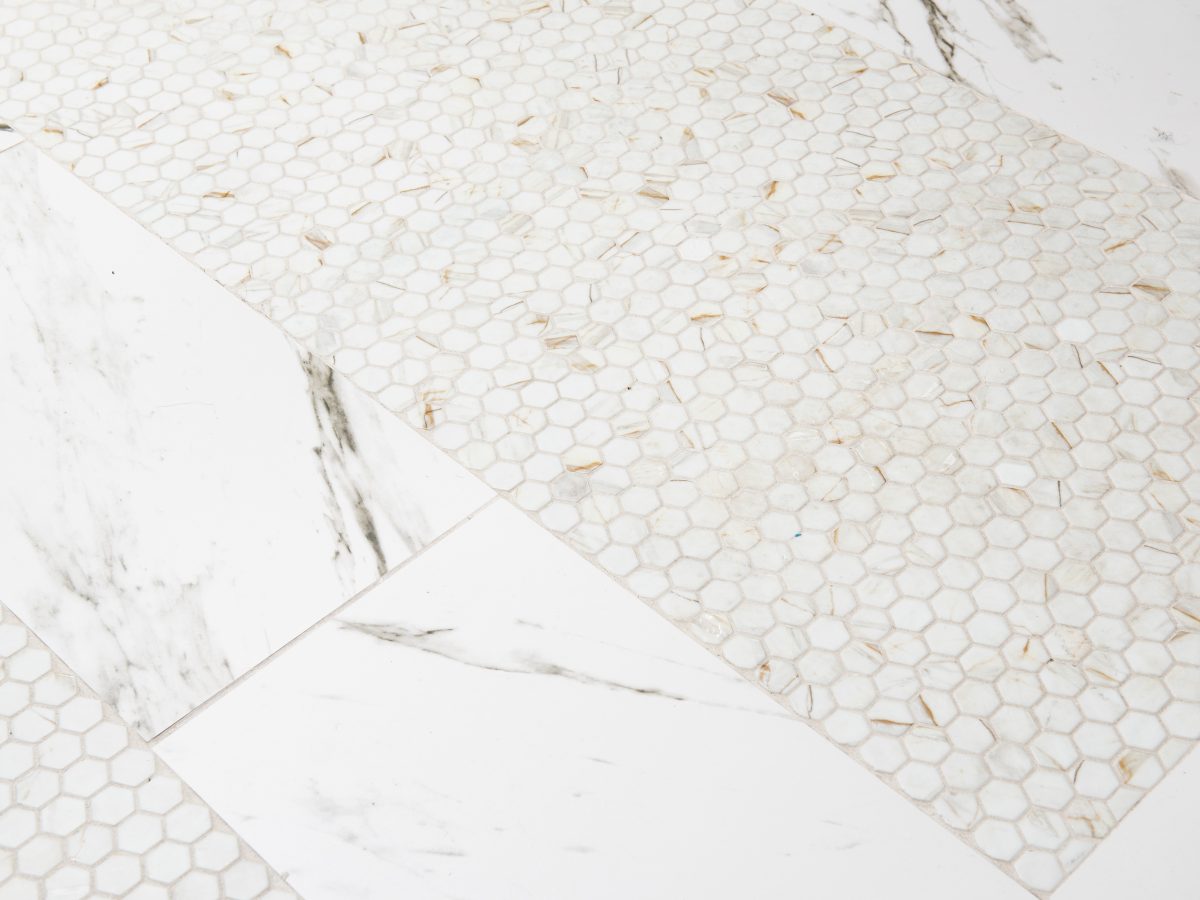 Primary bathroom with calacatta-look glass mosaic tile and calacatta porcelain floor, Reveal Interior Design Las Vegas